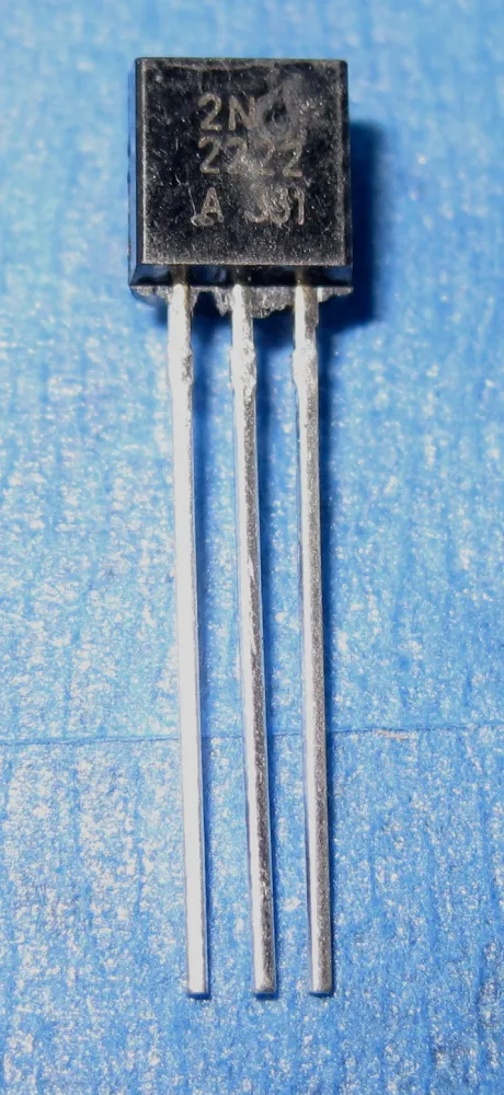 A 2N2222A NPN transistor in a black TO-92 plastic package